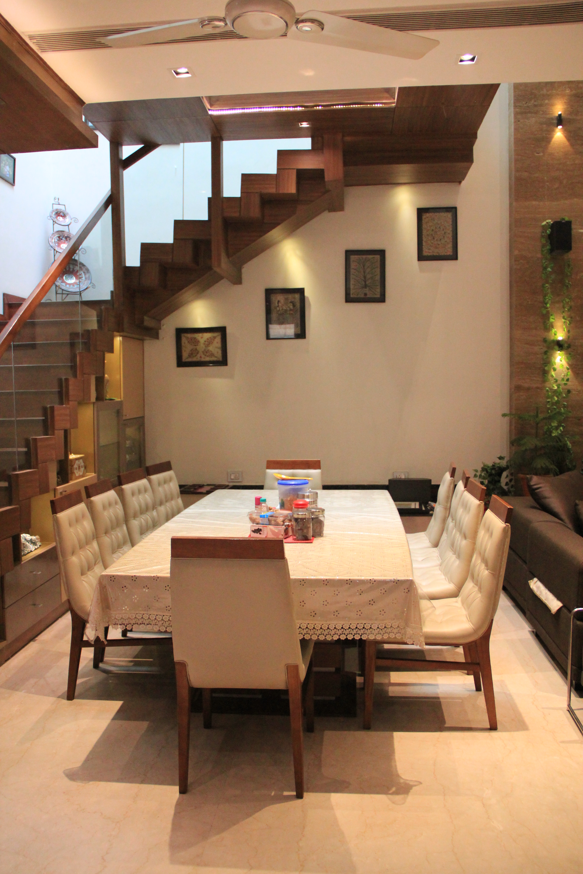 Dining Area With Display Shelves Under Staircase